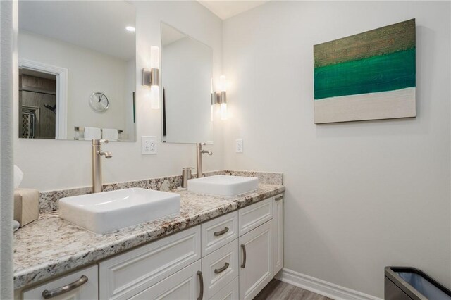 27705 Calle Valdes, Mission Viejo, CA 92692 - full bathroom featuring double vanity and wood finished floors