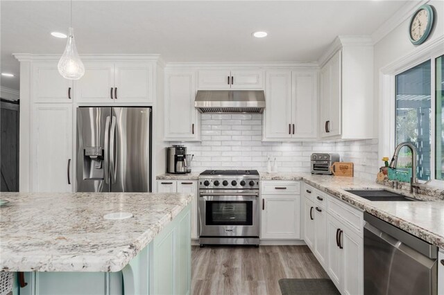 27705 Calle Valdes, Mission Viejo, CA 92692 - kitchen featuring appliances with stainless steel finishes, extractor fan, white cabinetry, ornamental molding, and recessed lighting