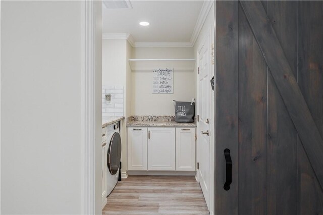 27705 Calle Valdes, Mission Viejo, CA 92692 - laundry room with ornamental molding, cabinet space, washer / dryer, light wood-type flooring, and recessed lighting