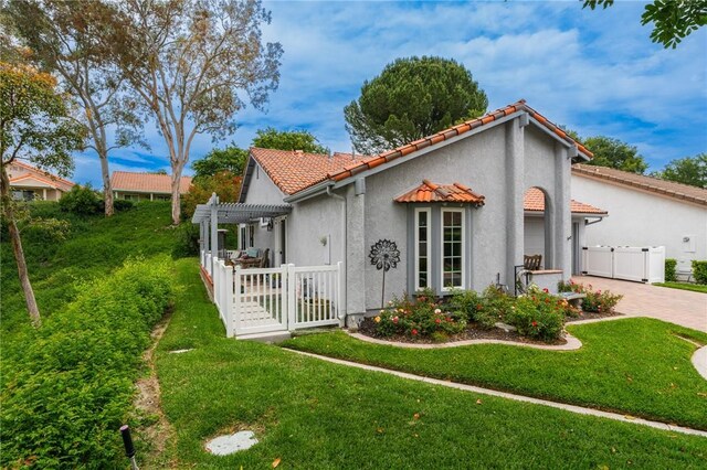 27705 Calle Valdes, Mission Viejo, CA 92692 - view of front of property with a gate, a pergola, decorative driveway, stucco siding, and a tile roof