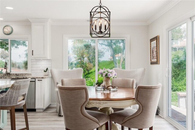 27705 Calle Valdes, Mission Viejo, CA 92692 - dining area featuring a chandelier, healthy amount of natural light, light wood finished floors, crown molding, and recessed lighting