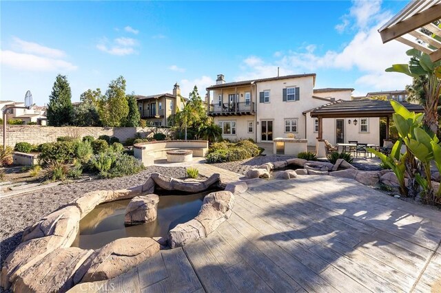 19599 Highland Terrace Dr, Walnut, CA 91789 - back of house featuring a jacuzzi, stucco siding, a patio area, and a chimney