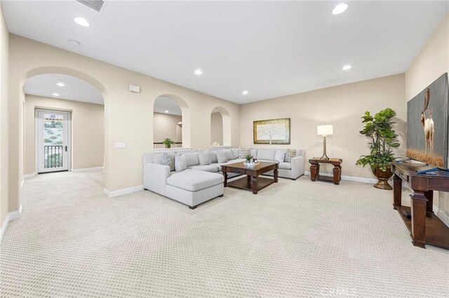 19599 Highland Terrace Dr, Walnut, CA 91789 - living room with light carpet, recessed lighting, baseboards, and arched walkways