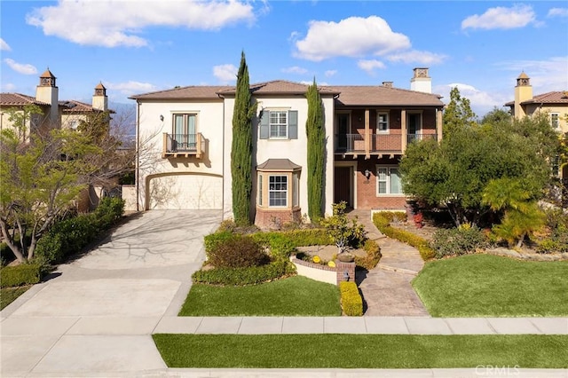 19599 Highland Terrace Dr, Walnut, CA 91789 - view of front of property featuring a balcony, concrete driveway, an attached garage, brick siding, and stucco siding