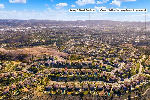 19599 Highland Terrace Dr, Walnut, CA 91789 - aerial view of property's location with nearby suburban area and a mountainous background