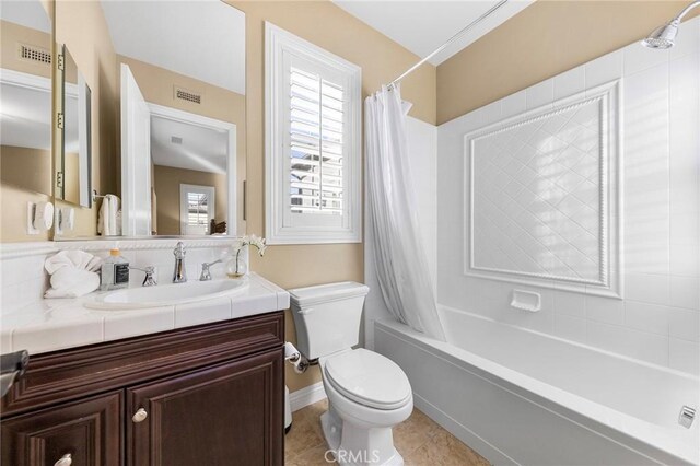 19599 Highland Terrace Dr, Walnut, CA 91789 - bathroom with toilet, vanity, healthy amount of natural light, and shower / tub combo with curtain