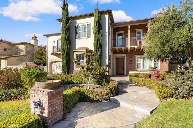 19599 Highland Terrace Dr, Walnut, CA 91789 - view of front of house with a balcony, brick siding, and stucco siding