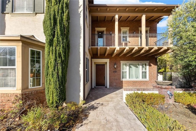 19599 Highland Terrace Dr, Walnut, CA 91789 - doorway to property with a balcony, brick siding, and stucco siding