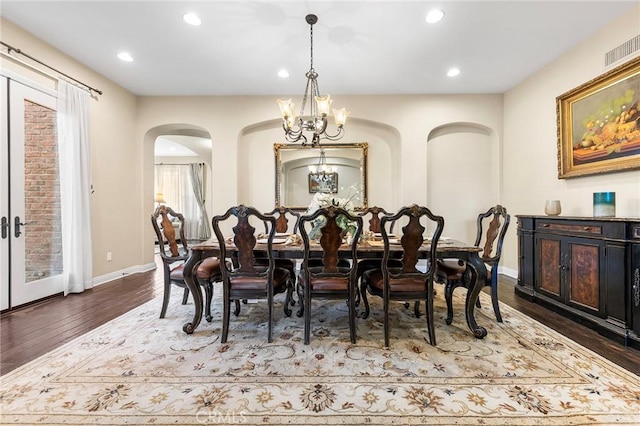 19599 Highland Terrace Dr, Walnut, CA 91789 - dining space featuring arched walkways, a chandelier, wood finished floors, recessed lighting, and baseboards