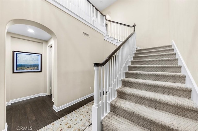 19599 Highland Terrace Dr, Walnut, CA 91789 - stairway featuring wood finished floors, baseboards, and arched walkways