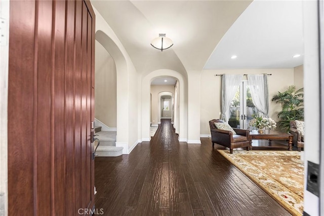 19599 Highland Terrace Dr, Walnut, CA 91789 - foyer with arched walkways, dark wood-type flooring, baseboards, recessed lighting, and stairs
