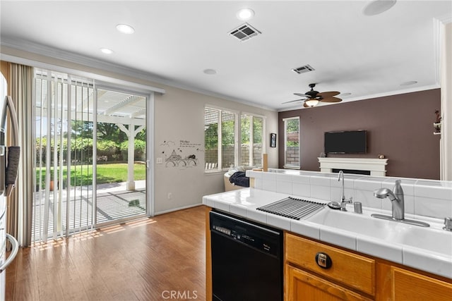 25562 Fitzgerald Ave, Stevenson Ranch, CA 91381 - kitchen with dishwasher, open floor plan, tile countertops, ornamental molding, and a ceiling fan
