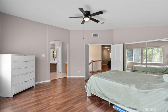 25562 Fitzgerald Ave, Stevenson Ranch, CA 91381 - bedroom with arched walkways, wood finished floors, and ceiling fan