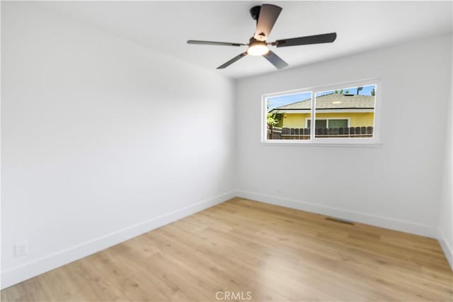 4561 N Price Ave, Fresno, CA 93726 - spare room with baseboards, light wood-style floors, and a ceiling fan