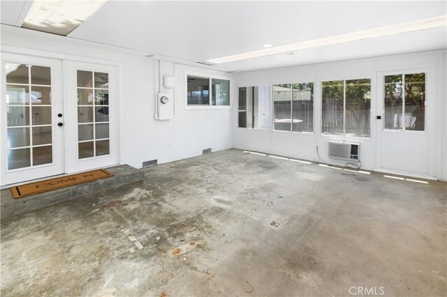 4561 N Price Ave, Fresno, CA 93726 - unfurnished sunroom with french doors, a wall mounted AC, and healthy amount of natural light