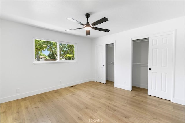 4561 N Price Ave, Fresno, CA 93726 - unfurnished bedroom with two closets, baseboards, light wood finished floors, and a ceiling fan