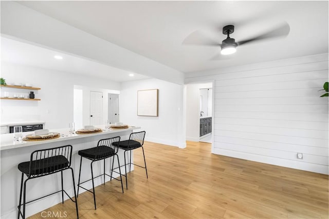 4561 N Price Ave, Fresno, CA 93726 - kitchen featuring a kitchen bar, light countertops, open shelves, light wood finished floors, and recessed lighting