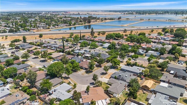 4561 N Price Ave, Fresno, CA 93726 - aerial view of property and surrounding area featuring nearby suburban area, a large body of water, and a notable bridge