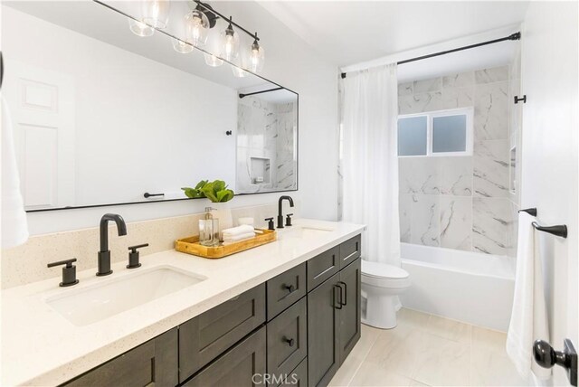 4561 N Price Ave, Fresno, CA 93726 - full bath with double vanity, shower / bath combo with shower curtain, toilet, and marble finish floors