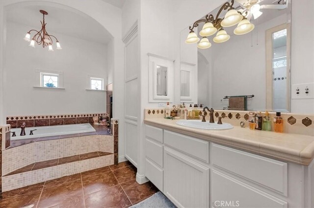 8401 Mayer Ave, Bakersfield, CA 93314 - bathroom featuring a chandelier, vanity, and a bath
