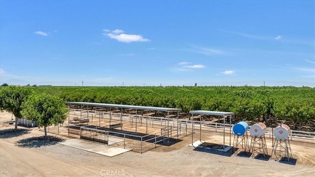 8401 Mayer Ave, Bakersfield, CA 93314 - view of patio / terrace featuring agricultural plots, a rural view, an exterior structure, and an outbuilding