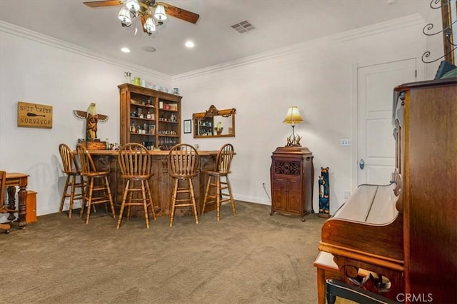 8401 Mayer Ave, Bakersfield, CA 93314 - carpeted dining room featuring a ceiling fan, a dry bar, ornamental molding, baseboards, and recessed lighting