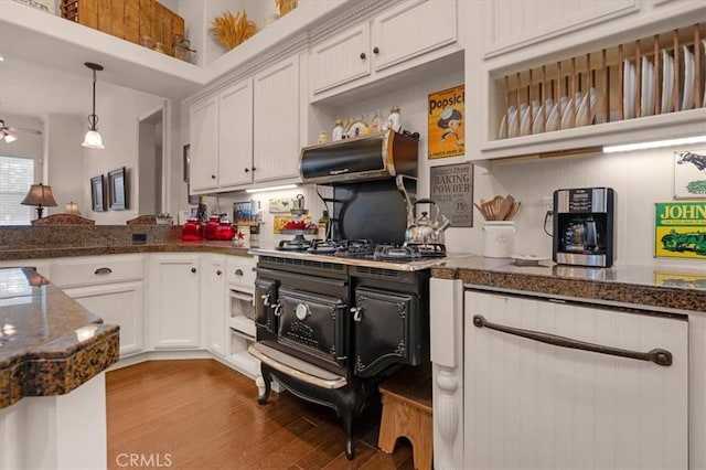8401 Mayer Ave, Bakersfield, CA 93314 - kitchen featuring white cabinetry, wood finished floors, hanging light fixtures, ceiling fan, and a peninsula