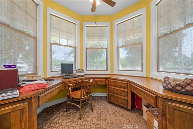 8401 Mayer Ave, Bakersfield, CA 93314 - home office with healthy amount of natural light, ceiling fan, and built in study area