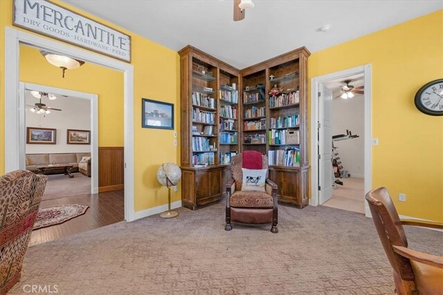 8401 Mayer Ave, Bakersfield, CA 93314 - sitting room featuring a ceiling fan, carpet floors, a wainscoted wall, and baseboards