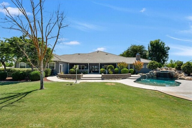8401 Mayer Ave, Bakersfield, CA 93314 - back of property with a lawn, an outdoor pool, and a chimney