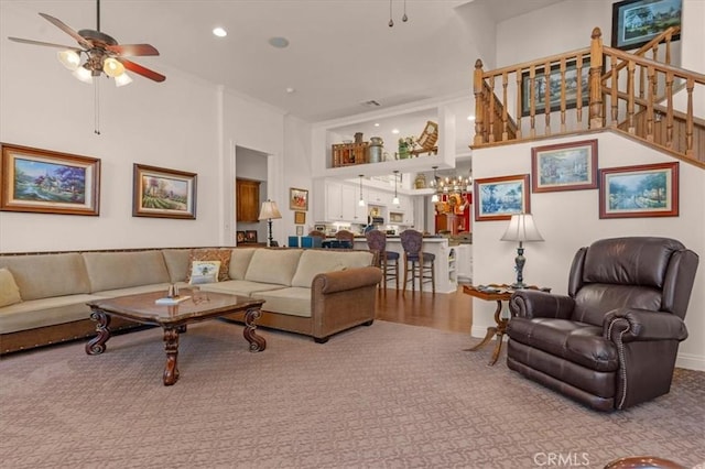 8401 Mayer Ave, Bakersfield, CA 93314 - living area featuring a ceiling fan, a towering ceiling, stairway, carpet floors, and recessed lighting