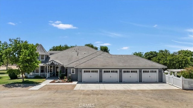 8401 Mayer Ave, Bakersfield, CA 93314 - view of front of home featuring driveway, an attached garage, and a tile roof