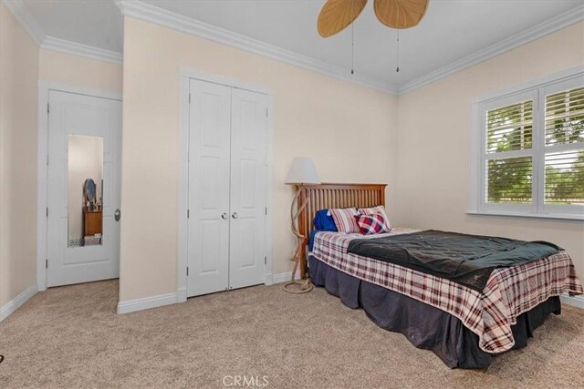 8401 Mayer Ave, Bakersfield, CA 93314 - bedroom with carpet flooring, crown molding, baseboards, a closet, and a ceiling fan
