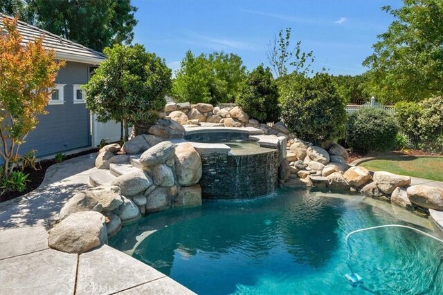 8401 Mayer Ave, Bakersfield, CA 93314 - view of swimming pool with a pool with connected hot tub