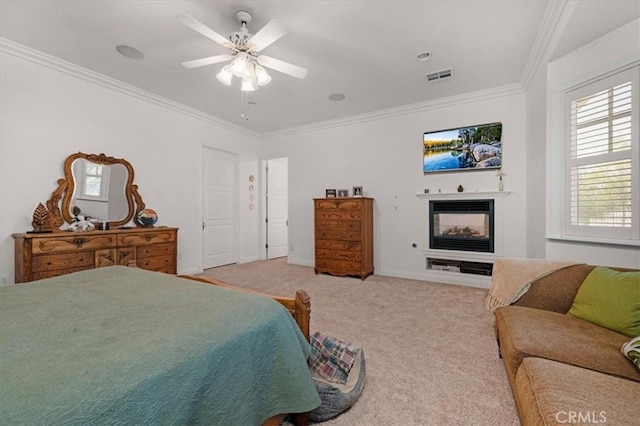 8401 Mayer Ave, Bakersfield, CA 93314 - bedroom featuring a glass covered fireplace, ornamental molding, multiple windows, light colored carpet, and a ceiling fan