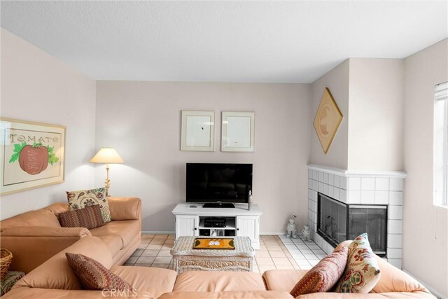 2300 Maple Ave Unit 138, Torrance, CA 90503 - living area featuring light tile patterned flooring and a tile fireplace