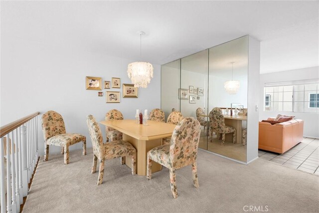 2300 Maple Ave Unit 138, Torrance, CA 90503 - dining room featuring a chandelier and carpet flooring