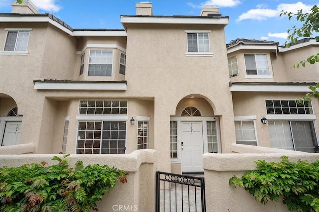 2300 Maple Ave Unit 138, Torrance, CA 90503 - view of front of home featuring stucco siding and a chimney
