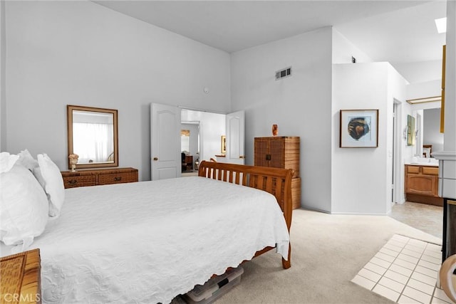 2300 Maple Ave Unit 138, Torrance, CA 90503 - bedroom featuring high vaulted ceiling, light colored carpet, and ensuite bathroom