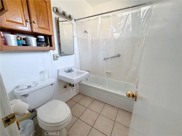 27441 Villa Ave, Highland, CA 92346 - bathroom featuring toilet, a sink, shower / tub combo with curtain, and tile patterned floors