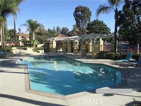 70 Costero Aisle Unit 304, Irvine, CA 92614 - community pool featuring a patio area