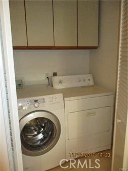 70 Costero Aisle Unit 304, Irvine, CA 92614 - laundry room featuring washing machine and dryer and cabinet space