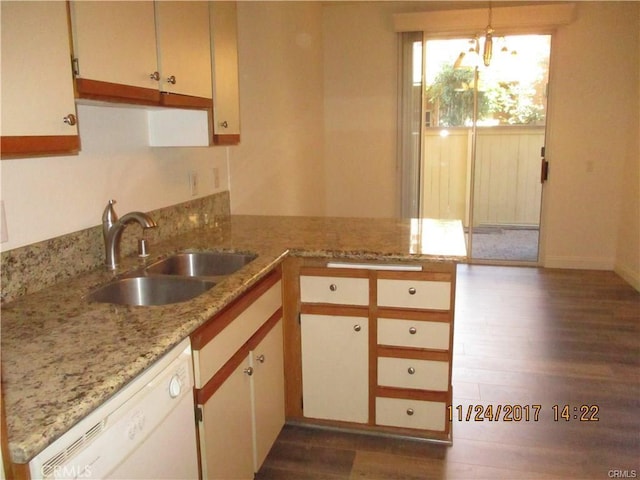 70 Costero Aisle Unit 304, Irvine, CA 92614 - kitchen with dishwasher, a peninsula, dark wood-style floors, light stone countertops, and pendant lighting