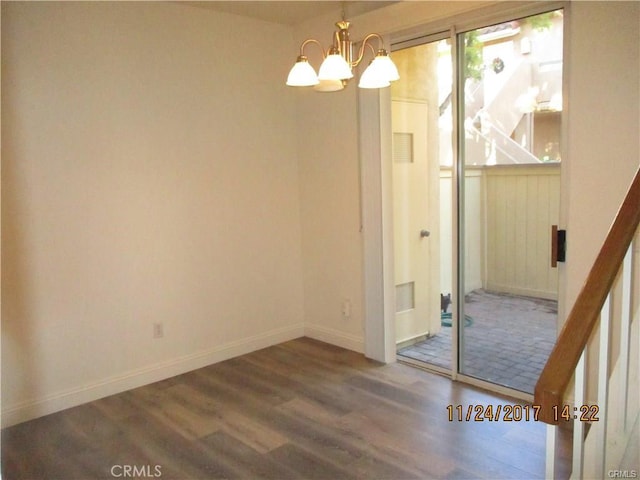 70 Costero Aisle Unit 304, Irvine, CA 92614 - unfurnished dining area featuring wood finished floors and a chandelier