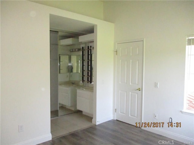 70 Costero Aisle Unit 304, Irvine, CA 92614 - unfurnished bedroom with wood finished floors and ensuite bathroom