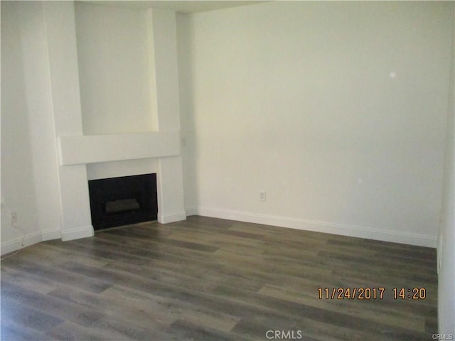 70 Costero Aisle Unit 304, Irvine, CA 92614 - unfurnished living room featuring a fireplace and wood finished floors