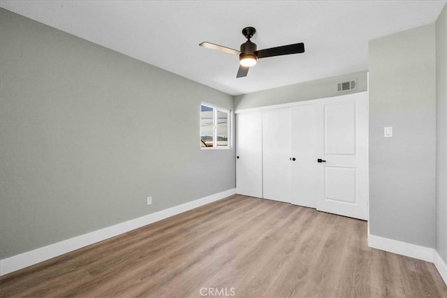 73461 El Paseo Dr Unit 29, Palms, CA 92277 - unfurnished bedroom with wood finished floors, a closet, and ceiling fan