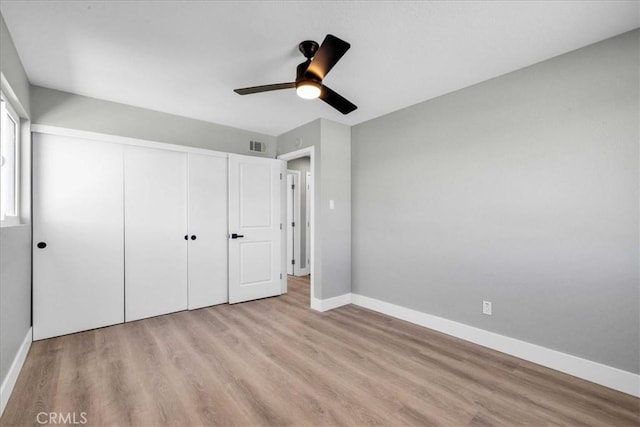 73461 El Paseo Dr Unit 29, Palms, CA 92277 - unfurnished bedroom featuring wood finished floors, a closet, and a ceiling fan