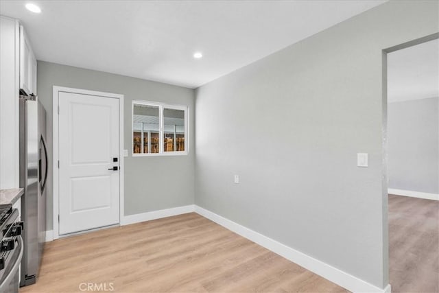 73461 El Paseo Dr Unit 29, Palms, CA 92277 - unfurnished dining area with light wood finished floors and recessed lighting