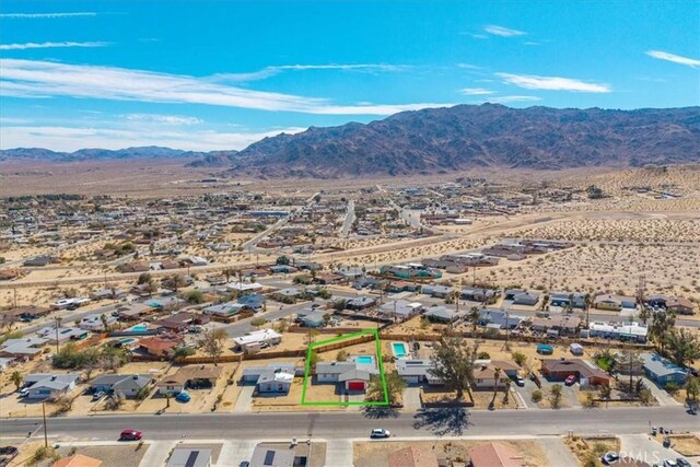 73461 El Paseo Dr Unit 29, Palms, CA 92277 - aerial perspective of suburban area featuring mountains and property parcel outlined
